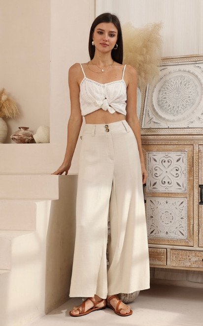 Designed for the modern woman who values both style and comfort, our Natalie Linen Blend Wide Leg Pants offer a flattering silhouette and luxurious feel. Crafted from a beautiful, soft linen/silk blend, they're perfect for warm weather and versatile enough to transition from casual daytime outings to chic evening gatherings. Featuring a comfortable high waist and a relaxed, flowing fit, our Natalie pants pair seamlessly with everything from fitted tops to oversized blouses. Elevate your wardrobe with this essential piece that promises both timeless appeal and ultimate comfort.

These pants feature:

Double button and zip front closure
Wide leg design
Functional side pockets
Linen/silk blend
Unlined
Colour: Natural

Fabric: 55% Linen; 45% Silk

Size Guide: True to size. Stick to your usual size