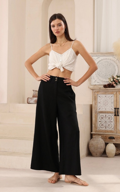 Designed for the modern woman who values both style and comfort, our Natalie Linen Blend Wide Leg Pants offer a flattering silhouette and luxurious feel. Crafted from a beautiful, soft linen/silk blend, they're perfect for warm weather and versatile enough to transition from casual daytime outings to chic evening gatherings. Featuring a comfortable high waist and a relaxed, flowing fit, our Natalie pants pair seamlessly with everything from fitted tops to oversized blouses. Elevate your wardrobe with this essential piece that promises both timeless appeal and ultimate comfort.

These pants feature:

Double button and zip front closure
Wide leg design
Functional side pockets
Linen/silk blend
Unlined
Colour: Black

Fabric: 55% Linen; 45% Silk

Size Guide: True to size. Stick to your usual size