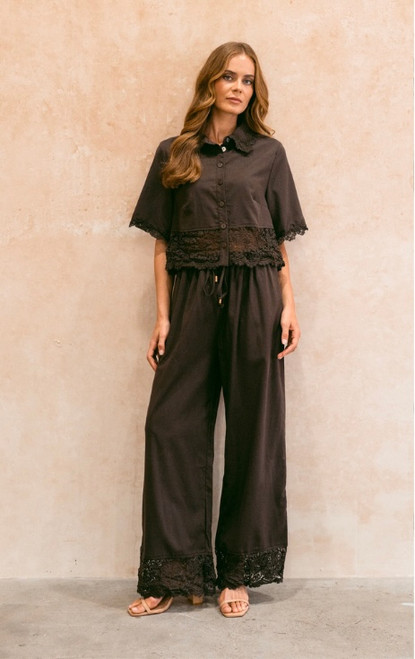 Lullaby Lace Pants in chocolate with a straight-leg silhouette and delicate lace-trimmed hems styled on a model