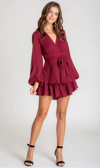 Stand out from the crowd with this stunning playsuit which is fully lined and features a gorgeous double layer ruffle. Pair with heels and you're ready to party!

This playsuit features:

V-neckline
Long bubble sleeves with elastic around the cuffs
Tie around the waist made from the same fabric
Fully lined
Double layer ruffle
Colour: Wine

Fabric: Polyester

Model is 168cm tall and wearing a size 6. 

Mel is a size 6-8 and wears a size 8.
Suburban Closet
