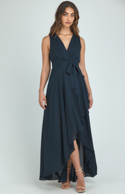 Bethany Dress in Navy

Get ready to stun the crowd this party season in the stunning, flowy Bethany dress! Pair with strappy nude heels to create an effortless, striking look.

This dress features:

V neckline
Sleeveless
Removable waist tie
Pleated front detail
Waterfall hem 
Maxi length
Lined

Suburban Closet