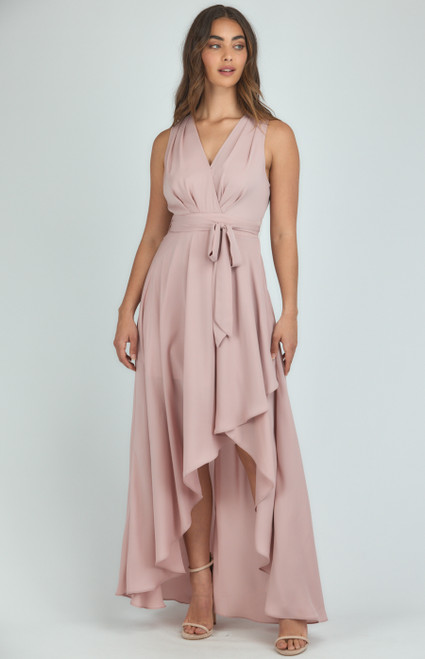 Get ready to stun the crowd this party season in the stunning, flowy Bethany dress! Pair with strappy nude heels to create an effortless, striking look.

This dress features:

V neckline
Sleeveless
Removable waist tie
Pleated front detail
Waterfall hem 
Maxi length
Lined

Suburban Closet