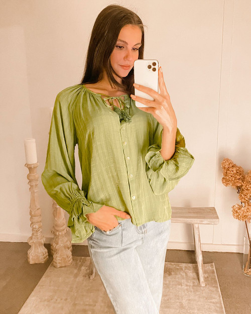 We are loving our fun and cute Gwenda Boho Top! This gorgeous lightweight, loose fitting top is perfect for any casual occasion. This top looks great when paired with a pair of dark denim jeans and heels or ankle boots.

This top features:

Round neckline
Front tie and tassel detail
Long sleeves with elastic cuffs and frill
Textured fabric
Colour: Khaki

Fabric: 100% Polyester

Size Guide: True to size.
Suburban Closet