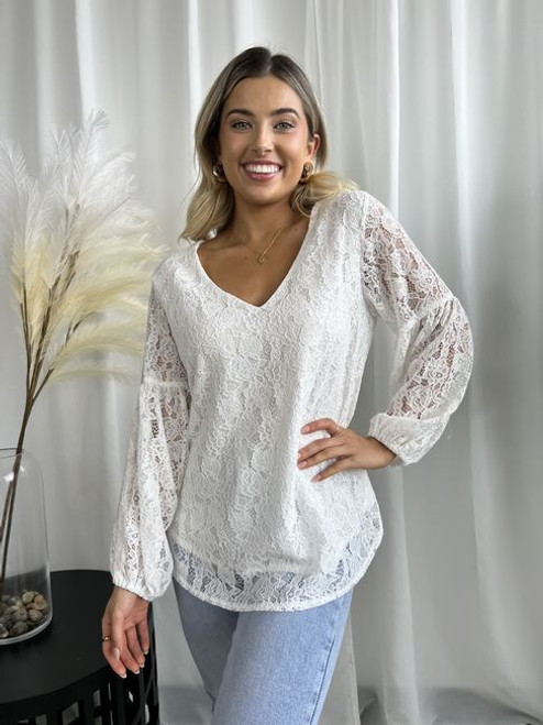 Our stunning Carrie Lace Blouse can easily be worn from work to weekend. Dress up with a pair of black or tan trousers or our comfy Billy Capri Pants for work or pair with denim jeans on the weekend.

This blouse features:

V-neckline
Lace detail
Balloon sleeves
Hi-Lo design
Fully lined
Colour: Off White

Fabric: Outer: 90% Cotton, 10% Polyester; Lining: 100% Rayon.

Size Guide: True to size - relaxed fit.
Suburban Closet
