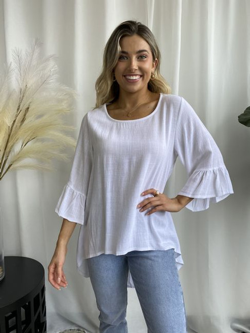 Our Brooke Hi-Lo Blouse is a perfect, basic staple for your everyday wardrobe. It can be easily thrown together with a pair of jeans or dressed up with a pair of slacks or capri pants.

This top features:

Round neckline
3/4 sleeves with frill detail
Hi-Lo design
Colour: White

Fabric: 70% Linen, 30% Viscose.

Size Guide: Oversized so size down for a more fitted look.
Suburban Closet