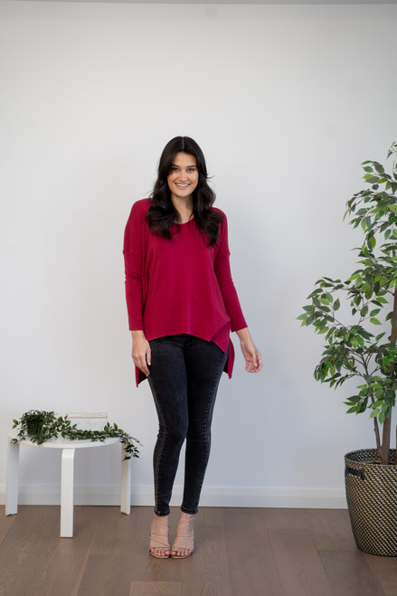 Our stylish long sleeve Willow Knit Top is so soft, light and comfortable. This top looks great teamed up with a gorgeous pair of boots and blue jeans.

This knit features: 

Asymmetrical hi-lo design
V-neckline
Split on each side
Long sleeves
Colour: Wine

Fabric: 85% Cotton, 10% Polyester and 5% Spandex

Size Guide: S/M will fit a size 8-12; M/L will fit 14-16.
Suburban Closet