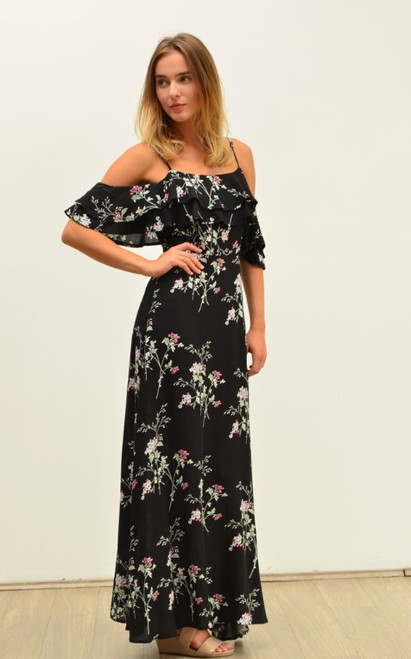 Gloria Ruffle Floral Maxi Dress in Black

Our Gloria Ruffle Floral Maxi Dress is fun, free spirited and flirty and perfect for those hot summer days or just lounging around in the sun at the beach when you're on vacation. Featuring a cold shoulder silhouette, this gorgeous dress is sure to become one of your Spring/Summer staples! Pair with our Tied in Knots Slides for a relaxed holiday look!

This dress features:

Ruffle along neckline and hem
Adjustable shoestring straps and dropped sleeve with ruffle
Invisible zipper at centre back
Lined under bust to knee
Maxi length
Colour: Black with Floral Design

Fabric: 100% Rayon

Size: True to size