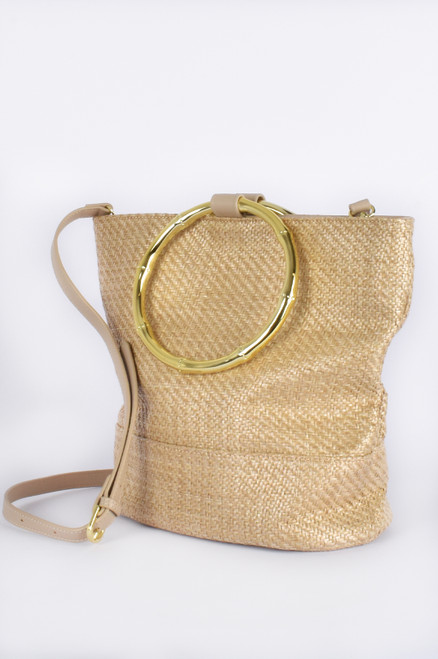 Our Mae Ring Handle Straw Tote Bag is perfect for spring picnics. Featuring statement gold rings that can be used as a handle or as a feature, this tote is an easy to wear with any of your spring/summer dresses.

This bag features: 

Fully lined
3 inside pockets, 1 with zip closure
Press stud closure
Gold plated metal handles
Faux leather strap
Colour: Natural

Material: Straw, Vegan Leather & Plated Metal

Measurements: L: 30cm, H: 27cm, D: 15cm