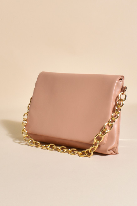 Our Isabelle Foldover Chain Bag is such a pretty piece! Featuring a gold statement chain that can be used as either a feature or a strap means this bag can be worn in a few different ways to refresh and elevate your look! 

This bag features:

Gold press stud closure
Gold chain strap
Removable faux leather strap
Internal pocket with zip 
Plenty of room for necessities
Colour: Peach and Gold

Material: Vegan Leather & Plated Metal

Measurements: L: 22cm, H: 17cm, D: 2cm