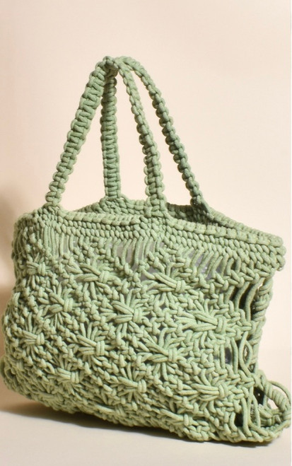 Our chic, fun Mila Hand Knotted Macrame Mini Tote is a great fashion accessory when you hit the beach this summer and perfect for tropical trips away!

This bag features:

Hand Knotted Macrame
Unlined
Colour: Green

Fabric: 100% Cotton

Dimensions: L: 34cm; H: 27cm; D: 3cm