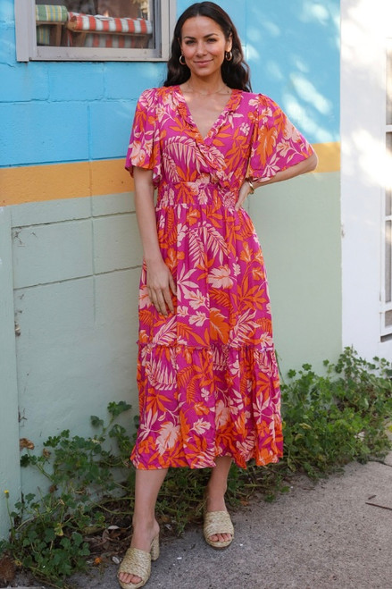 Get ready to go on vacation with our gorgeous Daria Cross-Over Midi Dress. This dress is perfect for fun days spent at the beach, park or on vacation. Pair with our Ibiza Strappy Slide in Nude and our Seaside Straw Bag for an easy, effortless summertime look.

This dress features:

V-neckline with frill detail
Cross-over front
Short flutter sleeves
2 inseam side pockets
Shirred waist
Tiered design with frill detail
Ruffled hemline
Unlined
Midi length
Colour: Purple with Orange Tropical Print

Fabric: 100% Rayon

Size Guide: True to size. Model is wearing size 8 and is 172cm tall. 

Please note that this dress is cut oversize to allow for shrinkage. It will shrink by 5-10% after first wash. It will then fall into the appropriate size range.