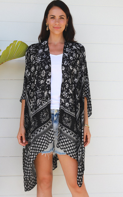 Our gorgeous Flower Bed Kimono is perfect for throwing on over the top of a pair of shorts and your favourite tee or just over your swimmers when you're relaxing at the beach or at the resort this summer!

Colour: Black

Fabric: Viscose

Size: OSFA