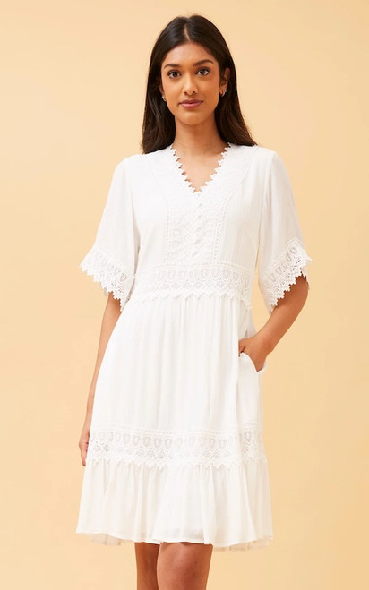 Step out in style in our Bohemia Mini Dress! This boho beauty will never go out of date and features gorgeous lace trim details, ruffled hemline and pockets!!! It is the perfect dress to wear to so many occasions such as Christenings, baby showers and brunch dates. Pair with wedged heels and gold accessories for a chic bohemian look.

This dress features:

V-neckline with lace trim detail
Short sleeves with lace trim cuffs
In seam side pockets
Lace trim on waist and hem
Ruffled hemline
Lined
Colour: White

Fabric: 100% Viscose

Size Guide: True to size. Model is 171cm tall and wears a Size 8.