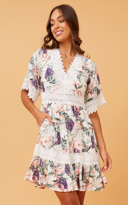 Step out in style in our Bohemia Floral Mini Dress! This boho beauty will never go out of date and features gorgeous lace trim details, ruffled hemline and pockets!!! It is the perfect dress to wear to so many occasions such as Christenings, baby showers and brunch dates. Pair with wedged heels and gold accessories for a chic bohemian look.

This dress features:

V-neckline with lace trim detail
Short sleeves with lace trim cuffs
In seam side pockets
Lace trim on waist and hem
Ruffled hemline
Lined
Colour: White with Floral Print

Fabric: 100% Viscose

Size Guide: True to size. Model is 173cm tall and wears a Size 8.