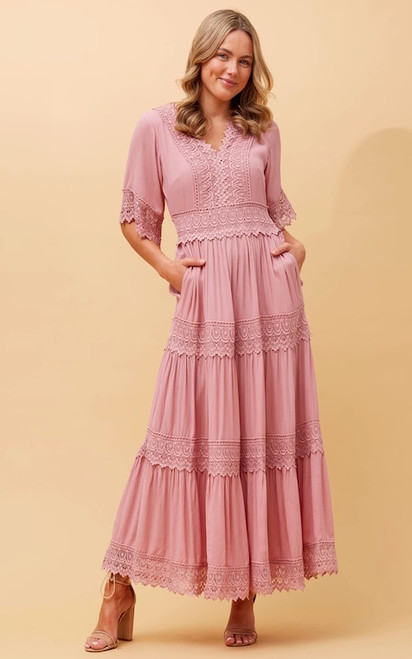 If you love the style of our Bohemia Mini Dress, but prefer something longer, then our Bohemia Maxi Dress is for you! This boho beauty will never go out of date and features gorgeous lace trim details, ruffled hemline and pockets!!! It is the perfect dress to wear to so many occasions such as Christenings, baby showers and brunch dates. Pair with wedged heels and gold accessories for a chic bohemian look.

This dress features:

V-neckline with lace trim detail
Short sleeves with lace trim cuffs
In seam side pockets
Tiered lace trim details
Ruffled hemline
Maxi length
Lined to above knees
Colour: Musk Pink

Fabric: 100% Viscose

Size Guide: True to size. Model is 171cm tall and wears a Size 8.