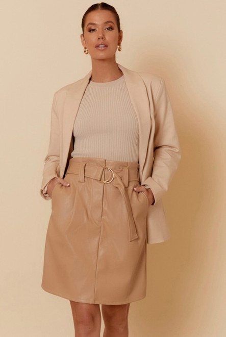 Give your wardrobe staples an edge with the addition of our Bella Faux Leather Skirt. It's perfect for styling from work to weekend!

This skirt features:

Zip & metal clip closure at front
Belt
High waisted
Elasticised back
2 in seam pockets
Knee length
Colour: Camel

Fabric: 45% PU, 55% Polyester

Size Guide: True to size. Model is 169cm tall and is a Size 08. Model wears Size 08.