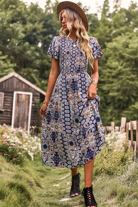 Introducing our Antionette Midi Dress! This gorgeous dress features a striking paisley print and shirred bodice for the perfect combination of style and comfort. Pair with tan ankle boots and our Colleen Ribbon Fedora for the perfect transeasonal boho look.

This dress features:

Round neckline with tie at back
Shirred bodice
Flutter sleeves
Tiered skirt with ruffled hemline
Lined skirt to knee
Midi length
Colour: Blue with Paisley Print

Fabric: 100% Rayon, Lining: 100% Cotton

Size Guide: True to size.
