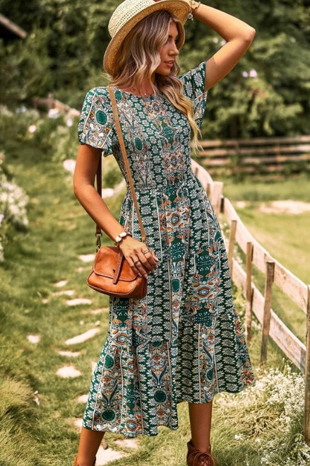 Introducing our Antionette Midi Dress! This gorgeous dress features a striking paisley print and shirred bodice for the perfect combination of style and comfort. Pair with tan ankle boots and our Colleen Ribbon Fedora for the perfect transeasonal boho look.

This dress features:

Round neckline with tie at back
Shirred bodice
Flutter sleeves
Tiered skirt with ruffled hemline
Lined skirt to knee
Midi length
Colour: Green with Paisley Print

Fabric: 100% Rayon, Lining: 100% Cotton

Size Guide: True to size.