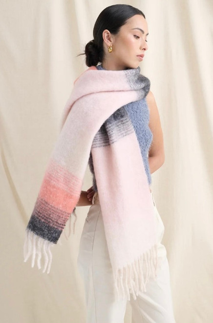 Our cosy Yura Gradient Fluffy Scarf features beautiful pink and grey tones in a gradient pattern. It also has a wide width and long length, which makes it the perfect stylish add on accessory for that warm and cosy feeling during the autumn/winter season.

This scarf features:

Fluffy fabrication
Tassel ends
Heavy weight
Colour: Pink

Fabric: 100% Acrylic

Measurements: L: 227cm (Tassel to Tassel); W: 39cm