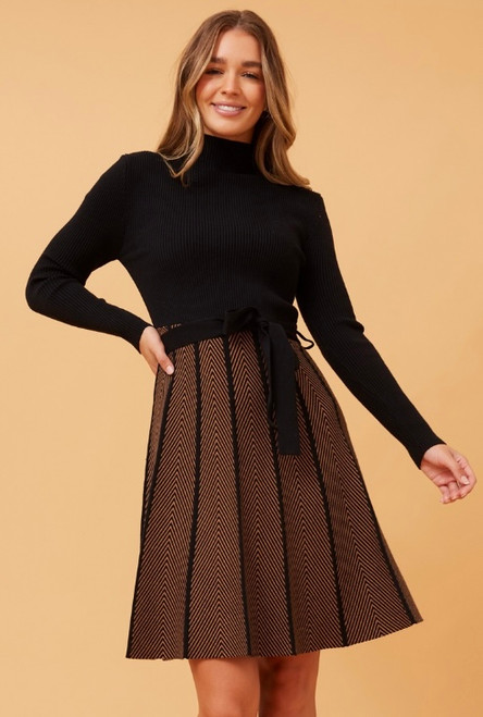Our Catherine Ribbed Knit Dress will take you from desk to drinks in no time! This knit dress is not only so warm and cosy, but super stylish. Featuring a ribbed fitted, high neck bodice and contrasting flared skirt, this dress will become your new go to winter style! Pair this dress a statement necklace or earrings, and a pair of black boots to complete your work to date night look.

This dress features:

High neck
Long fitted sleeves
Removable waist tie made of same fabric
Contrasting flared skirt with soft pleats
Fitted bodice
Knee length
Mid weight
Non lined
Colour: Tan

Fabric: 50% Viscose, 22% Nylon 28% Polyester

Size Guide: True to size.
