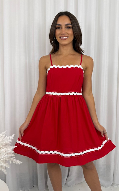 Make a statement in our Elle Linen Blend Ric Rac Dress – a bold and playful addition to your spring/summer wardrobe. Featuring crisp white ric rac trim against a vibrant red linen blend, this dress brings retro charm with a modern twist. The square neckline with adjustable straps and the flared skirt create a flattering, feminine silhouette that’s as comfortable as it is eye-catching. Perfect for picnics, parties, or festive days out, this dress is made to stand out and turn heads.

This dress features:

Square neckline
Adjustable straps
A-line skirt
Invisible zip on the side
Ric rac trim
Knee length
Unlined
Colour: Red with White Ric Rac Trim

Fabric: 70% Linen, 30% Viscose

Size Guide: True to size. Model is wearing a size 8.