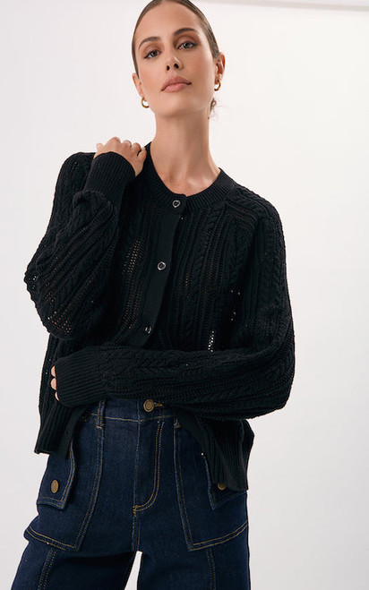 Elevate your everyday style with our Addison Cotton Knit Cardigan, a timeless layering piece designed for effortless sophistication. Crafted from soft, breathable cotton with intricate cable detailing, this cardigan offers both comfort and elegance. The button-front design and relaxed fit make it easy to style open over a cami or buttoned up for a polished finish. Perfect for pairing with denim, tailored pants or thrown over a dress, this cardi transitions seamlessly from casual days to chic evenings. A versatile wardrobe staple you’ll reach for season after season.

This cardigan features:

Rounded neckline
Buttoned front opening
Long sleeves with ribbed cuffs
Ribbed hemline
Cable knit detailing with breathable texture
Relaxed fit
Colour: Black

Fabric: 100% Cotton

Size Guide: Model is wearing a size 8 and is a standard size 8 with Bust: 86cm, 
Waist: 60cm, Hips: 89cm.