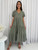 Discover effortless charm and ultimate comfort with our Annique Linen Blend Midi Dress. Featuring a stylish V-neckline with a button-front detail, delicate short sleeves, and a flowing tiered skirt, this dress combines classic elements with modern ease. The relaxed fit ensures comfort, while the practical side pockets add a touch of everyday convenience. Perfect for transitional seasons, casual outings or dressing up with accessories. Pair it with sandals for a breezy daytime look or elevate it with wedges and statement jewellery for a relaxed evening outing.

This dress features:

V-neckline
Short sleeves
Functional button up front
Functional side pockets
Tiered skirt and ruffled hemline
Linen front and skirt to knees
Relaxed fit
Colour: Khaki

Fabric: 70% Linen, 30% Viscose; Lining: 100% Rayon

Size Guide: Relaxed fit.