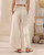 Designed for the modern woman who values both style and comfort, our Natalie Linen Blend Wide Leg Pants offer a flattering silhouette and luxurious feel. Crafted from a beautiful, soft linen/silk blend, they're perfect for warm weather and versatile enough to transition from casual daytime outings to chic evening gatherings. Featuring a comfortable high waist and a relaxed, flowing fit, our Natalie pants pair seamlessly with everything from fitted tops to oversized blouses. Elevate your wardrobe with this essential piece that promises both timeless appeal and ultimate comfort.

These pants feature:

Double button and zip front closure
Wide leg design
Functional side pockets
Linen/silk blend
Unlined
Colour: Natural

Fabric: 55% Linen; 45% Silk

Size Guide: True to size. Stick to your usual size