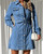 Model wearing the Georgia denim dress in mid blue, a long sleeve button-down belted denim mini dress styled with heels