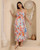 Aloha Maxi Dress featuring colourful tropical floral print, ruffle details and flowing maxi skirt