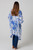 Model wearing the easy open-front Sapphire Leaf kimono over a beige top and dark wash flared jeans. The lightweight white kimono shows a prominent royal blue and slate blue abstract leaf print with a solid blue border framing the edges.