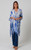 Model wearing the easy open-front Sapphire Leaf kimono over a beige top and dark wash flared jeans. The lightweight white kimono shows a prominent royal blue and slate blue abstract leaf print with a solid blue border framing the edges.