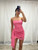 Model wearing  the Kristin Strapless bodycon mini dress featuring front ruched chiffon fabric and an asymmetrical side drape.