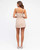 Model wearing the Harper beige playsuit with a square neckline, thin shoulder straps, belted waist and wrap-style skirt overlay.