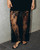 Trinity Lace Maxi Dress in black featuring short sleeves and a sheer floral lace lower panel.