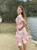 Get ready to go on vacation with the gorgeous Sandy Cross-Over Dress. This dress is perfect for beautiful days spent at the beach, park or casual lunches. Pair with white sandals for a easy, effortless day look.

This dress features:

V-neckline
Short sleeves
2 side pockets
Lined 
Ruffled hemline
Midi length
Hidden button closure at front
Invisible zip at back
Removable tie of same fabric
Suburban Closet