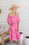 Our stunning Sahara Midi Dress is sure to become a staple in your wardrobe! It's so pretty, flattering and just so flowy! What more could any girl want?! It's a perfect transeasonal style that will look great with a denim jacket thrown over the top and ankle boots.

This dress features:

Off the shoulder neckline
Sleeveless
In seam pockets
Elasticised waist with lots of stretch
Tiered skirt
Double frill from neckline with crochet detailing
Midi length
Colours: Pink

Fabric: 100% Viscose

Size: Generous sizing!!! You may want to drop down 2 sizes from your usual size!
Suburban Closet