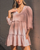 This cute smock dress is perfect for any occasion! It's so easy to wear and can be dressed up with tan ankle boots and a tan belt or worn with white sneakers or sandals for a more casual look. It's also a great dress that can be worn with a growing baby bump throughout all the seasons!

This dress features:

V-neckline
Tiered design
A touch longer at the back than the front
Long sleeves with elastic cuffs
Not lined
No stretch
Colour: Blush

Fabric: Cotton/Spandex blend

Size Guide: This dress is true to size.
Suburban Closet