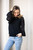 You will fall in love with our super soft and comfy Chantelle Knit. This knit is perfect to transition from day to night and the chiffon detail on the sleeves give this lightweight, comfy knit a super chic vibe! Pair with our Wet Look Skinny Jeans or your fave denim and some boots and you're ready for a night out!

This knit features:

Round ribbed neck
Long chiffon balloon sleeves with billowing detail with fitted cuffs
Straight ribbed hem
Super soft feel
Colour: Black

Fabric: Cotton/Polyester Blend

Size Guide: S/M will fit sizes 6-10 and L/XL will fit sizes 12-14.