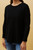 Our Joni Ribbed Knit is an easy go-to top that can be worn under anything! Pair with high-waisted jeans and sneakers for a casual and cosy look perfect for those weekend errands.

This knit features:

Round neck
Long dolman sleeves
Ribbed design
Curved round hem
Colour: Black

Fabric: 98% Polyester, 2% Spandex

Size Guide: True to size! Model is 173cm and wears a size 8. Model 2 is 174cm and wears a size 14.