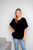 Tillie Chiffon Top in Black

So chic, yet so sweet, our Tillie Chiffon Top is going to be your new fave this summer. This cotton blend beauty features a flowy design and flutter sleeves. Dress up with a pair of our Wet Look Skinny Jeans or wear it casually with your fave denim. 

This top features:

V-neckline
Flutter sleeves
Textured chiffon fabric
Curved hemline
Longer length at the back
Lined
Relaxed fit
Colour: Black

Fabric: 85% Cotton, 15% Polyester

Size Guide: True to size. Order your usual size as this top is meant to be flowy and relaxed.