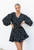 Stand out from the crowd in our gorgeous Alana Dress. Featuring gorgeous, long balloon sleeves and flared skirt, this dress is perfect for any upcoming events. Pair with black strappy heels and matching clutch and you're good for a great night out!

This dress features:

V-neckline
Button up front
Removable waist tie
Long balloon sleeves with elasticised cuffs
Flared skirt
Mini length
Not lined
Colour: Black with White Polka Dots

Fabric: 100% Rayon

Size Guide: True to size. Model is 170cm tall and wearing a size 6.