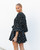 Stand out from the crowd in our gorgeous Alana Dress. Featuring gorgeous, long balloon sleeves and flared skirt, this dress is perfect for any upcoming events. Pair with black strappy heels and matching clutch and you're good for a great night out!

This dress features:

V-neckline
Button up front
Removable waist tie
Long balloon sleeves with elasticised cuffs
Flared skirt
Mini length
Not lined
Colour: Black with White Polka Dots

Fabric: 100% Rayon

Size Guide: True to size. Model is 170cm tall and wearing a size 6.