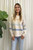 Our warm and cosy, wool blend Adeline Knit is super soft and comfy. The blue and tan stripe detailing adds a striking touch and the hi-low hemline covers you in all the right places. Dress this knit up with our Wet Look Skinny Jeans and ankle boots for a stunning look will love this winter!

This knit features:

Round ribbed neckline
Ribbed cuffs and hem
Hi-low hemline
Side splits
Dropped shoulders
Wool blend
Has some stretch
Colour: Latte with Blue and Tan Stripe Detail

Fabric: 65% Acrylic, 35% Wool

Size Guide: S/M will fit sizes 8-12, M/L will fit sizes 14-16.