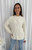 Wrap yourself in cosy elegance with our Aspen Wool Blend Knit in a timeless ivory hue. This soft, plush knit features a beautifully textured cable pattern that adds both warmth and style to your winter wardrobe. With its relaxed fit, ribbed hem and cuffs and classic crew neckline, this sweater is perfect for layering or wearing solo for an effortlessly chic look. Pair it with your favourite denim for a classic winter vibe or dress it up with a midi skirt or our Wet Look Skinny Jeans and boots.

This knit features:

Round ribbed neckline
Ribbed cuffs and hem
Cable knit design
Wool blend
Has some stretch
Soft feel
Colour: Ivory

Fabric: 65% Acrylic, 35% Wool

Size Guide: S/M will fit sizes 8-12, M/L will fit sizes 14-16. Model is wearing a size S/M and is 172cm tall.