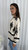 Effortlessly transition from office chic to weekend casual with our stylish Lisette Blouse. Designed for versatility, this blouse features a timeless silhouette that’s perfect for work meetings yet relaxed enough for after-hours plans. Featuring a mandarin collar, elasticised cuffs, button up front and striking geometric print for the perfect combination of style, practicality and comfort. Pair with tailored pants for a professional look or with denim for a laid-back weekend.

This blouse features:

Mandarin collar
Shirred neckline
Long sleeves with elastic cuffs
Button up front
Relaxed fit
Unlined
Colour: Cream with Black Geometric Print

Fabric: 90% Viscose, 10% Nylon

Size Guide: True to size. Model is 172cm tall and is wearing a size 8.