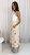 Embrace effortless island vibes in our Palm Breeze Embroidered Wide Leg Pants. Crafted in a lightweight fabric, these beige beauties feature a relaxed silhouette, elasticised waist, and intricate palm tree embroidery for a laid-back luxe look. The stunning border detail adds a boho-chic finish, making them the perfect statement piece for beach strolls, brunches, or your next getaway. Pair with a tank top or cropped blouse and slides for easy resort style.

These pants feature:

Elasticised waist with drawstring
2 side pockets
Full length, wide leg fit
Embroidered detailing
Lightweight
Unlined
Colour: Beige with Black Embroidery

Fabric: 90% Viscose, 10% Nylon

Size Guide: True to size. Model is wearing a size 8 and is 172cm tall.
