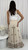Embrace effortless island vibes in our Palm Breeze Embroidered Wide Leg Pants. Crafted in a lightweight fabric, these beige beauties feature a relaxed silhouette, elasticised waist, and intricate palm tree embroidery for a laid-back luxe look. The stunning border detail adds a boho-chic finish, making them the perfect statement piece for beach strolls, brunches, or your next getaway. Pair with a tank top or cropped blouse and slides for easy resort style.

These pants feature:

Elasticised waist with drawstring
2 side pockets
Full length, wide leg fit
Embroidered detailing
Lightweight
Unlined
Colour: Beige with Tan Embroidery

Fabric: 90% Viscose, 10% Nylon

Size Guide: True to size. Model is wearing a size 8 and is 172cm tall.