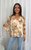 Refresh your wardrobe with our Meadow Bloom Floral Blouse, a timeless piece designed for effortless style. Showcasing a statement floral print in warm peach and blush tones, this blouse brings a touch of femininity to any look. The relaxed silhouette, button-down front, and shirred cuffs make it both comfortable and chic, perfect for casual weekends, office wear, or evenings out. Pair with your favourite denim for a casual-chic vibe or style with tailored pants and heels for an elevated look.
This blouse features:
Mandarin collar
Shirred neckline
Long sleeves with elastic cuffs
Button up front
Relaxed fit
Lined
Colour: Cream with Floral Print
Fabric: 80% Rayon, 20% Nylon; Lining: 100% Rayon
Size Guide: True to size. Model is 172cm tall and is wearing a size 8. Refresh your wardrobe with our Meadow Bloom Floral Blouse, a timeless piece designed for effortless style. Showcasing a statement floral print in warm peach and blush tones, this blouse brings a touch of femininity to any look. The relaxed silhouette, button-down front, and shirred cuffs make it both comfortable and chic, perfect for casual weekends, office wear, or evenings out. Pair with your favourite denim for a casual-chic vibe or style with tailored pants and heels for an elevated look.
This blouse features:
Mandarin collar
Shirred neckline
Long sleeves with elastic cuffs
Button up front
Relaxed fit
Lined
Colour: Cream with Floral Print
Fabric: 80% Rayon, 20% Nylon; Lining: 100% Rayon
Size Guide: True to size. Model is 172cm tall and is wearing a size 8.