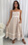 Our Shanae Linen Blend Midi Dress is the perfect blend of elegance and comfort. Crafted in a soft cotton and linen blend with playful white pic rac trim, this midi dress is ideal for sunny days, holidays, and relaxed weekends. Designed with adjustable spaghetti straps, a flowy silhouette, and practical side pockets, it’s a timeless piece that you’ll reach for year after year. Style effortlessly with our Ibiza Strappy Slides in camel for a casual daytime look, or elevate it with wedges and gold accessories for an evening out.
This dress features:
Shirring at back
Tiered skirt
Adjustable straps
Side pockets
Frilled hemline with ric rac detail
Ric rac detail poking up from front bodice
Unined
Colour: Natural with White Ric Rac Trim 
Fabric: 70% Cotton, 30% Linen
Size Guide: True to size Our Shanae Linen Blend Midi Dress is the perfect blend of elegance and comfort. Crafted in a soft cotton and linen blend with playful white pic rac trim, this midi dress is ideal for sunny days, holidays, and relaxed weekends. Designed with adjustable spaghetti straps, a flowy silhouette, and practical side pockets, it’s a timeless piece that you’ll reach for year after year. Style effortlessly with our Ibiza Strappy Slides in camel for a casual daytime look, or elevate it with wedges and gold accessories for an evening out.
This dress features:
Shirring at back
Tiered skirt
Adjustable straps
Side pockets
Frilled hemline with ric rac detail
Ric rac detail poking up from front bodice
Unined
Colour: Natural with White Ric Rac Trim 
Fabric: 70% Cotton, 30% Linen
Size Guide: True to size